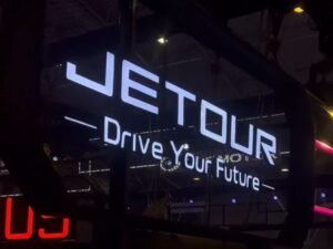 blue and white led signages and orange colored signages in a exhibition room