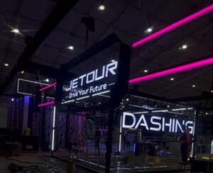 blue and white led signages and orange colored signages in a exhibition room