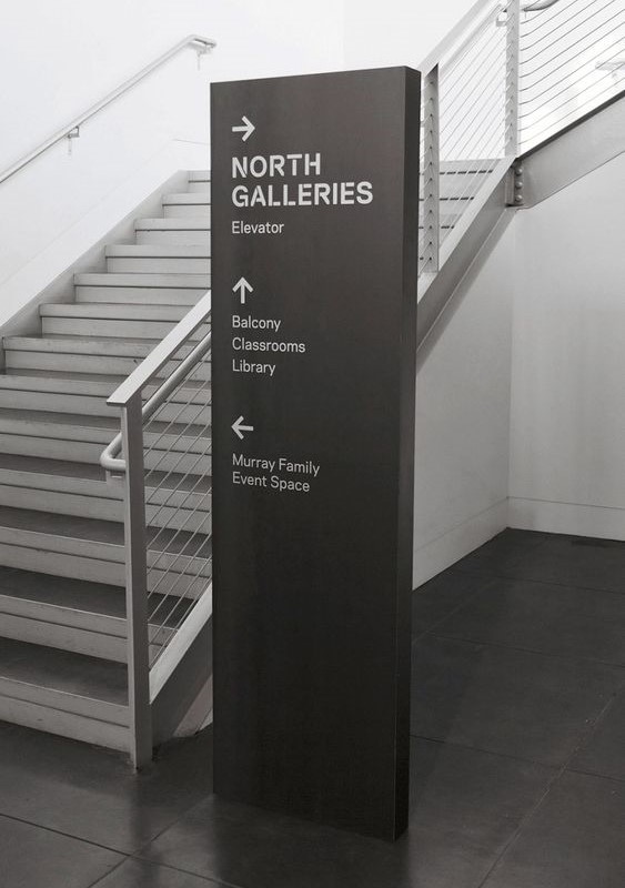 a signage that appeard in side of a staircase and its a way finding signage