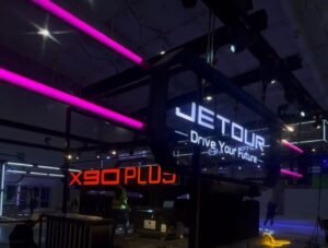 blue and white led signages and orange colored signages in a exhibition room