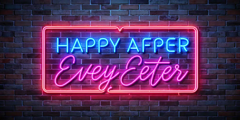 Neon sign with colorful text on a brick wall, related to custom neon signs.